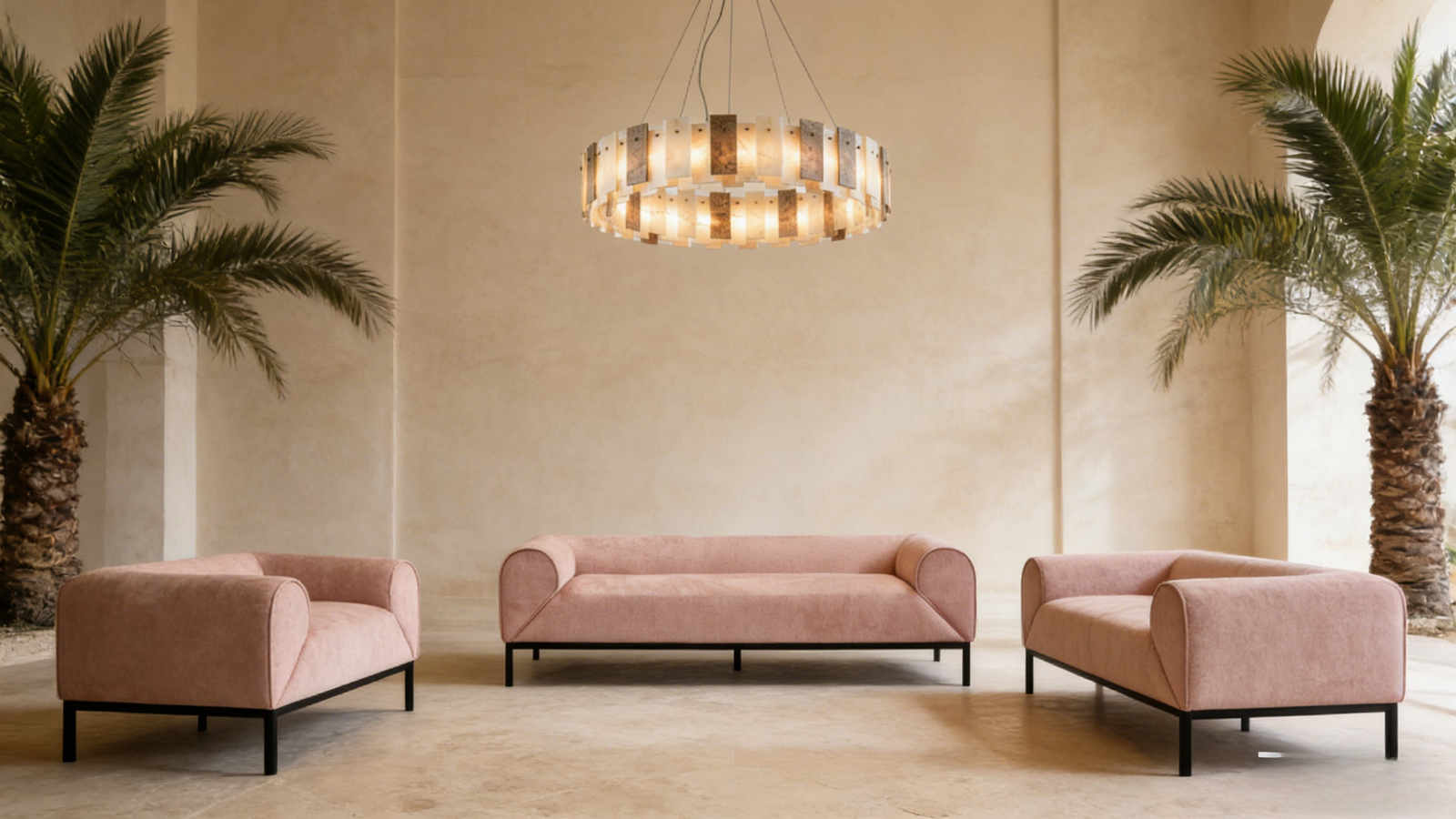 Modern living room with pink sofa set and decorative chandelier.