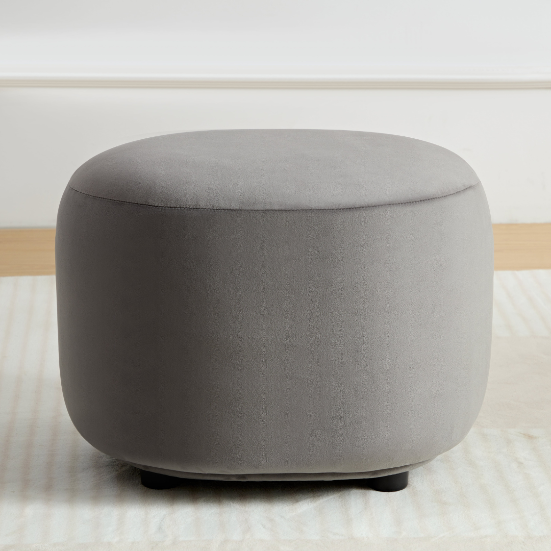 Curvo Velvet Oval Ottoman - Grey on Front View in Room Setting