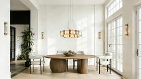 Modern dining room with wooden table and chairs near large windows.