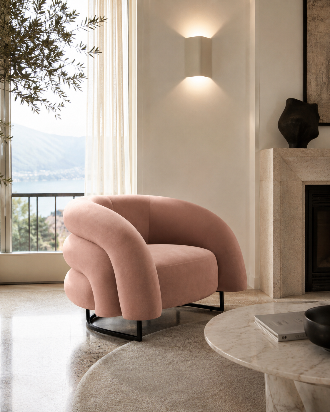 A blush pink velvet accent chair with a curved, sculptural backrest and black metal legs, positioned in a modern living room next to a marble fireplace and a large window with an outdoor view.
