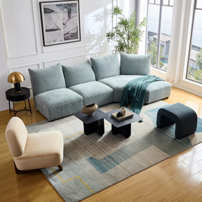 Marine Modular Sofa on Front View in White Background Marine Modular Sofa with Farah Occasional Chair and Arch Bench Ottoman Premium Blue Boucle on Angled Top View in Living Room