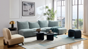 Marine Modular Sofa with Farah Occasional Chair and Arch Bench Ottoman Premium Blue Boucle on Side Angle in Living Room