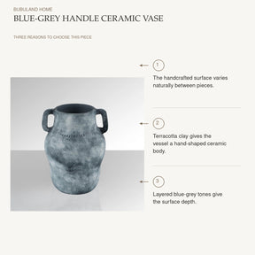 Blue-Grey Handle Ceramic Vase: The handcrafted surface varies naturally between pieces. Terracotta clay gives the vessel a hand-shaped ceramic body. Layered blue-grey tones give the surface depth.