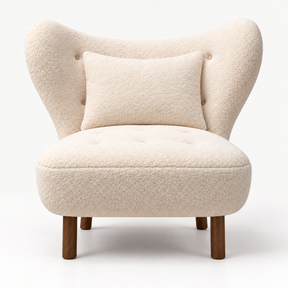 Fleur Lounge Chair in ivory faux sheepskin with matching cushion, front view