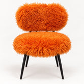 Orange faux sheep fur dining chair front view with black metal legs