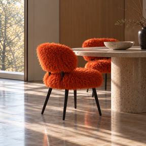 Orange faux sheep fur dining chair styled with a stone dining table