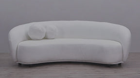 Video of Curvo 3 Seater Pure White Boucle Sofa with a curved shape and two boucle ball cushions
